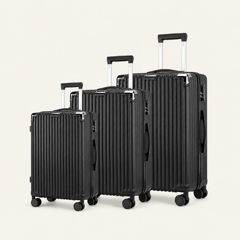 Ensemble trio, trois valises rigides — packshot sur fond ivoire