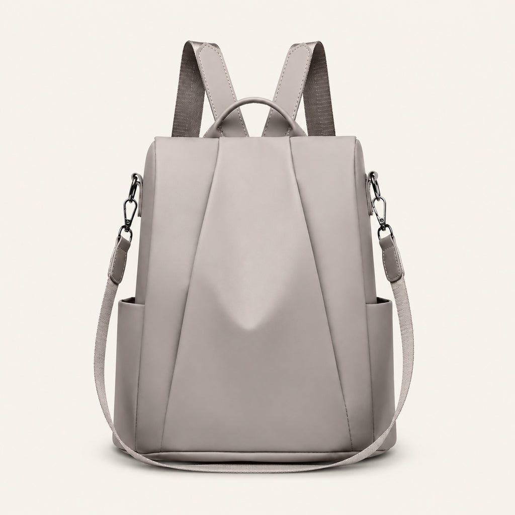 Sac à dos antivol, fermeture dorsale — packshot sur fond ivoire